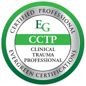 A woman wearing a coat and glasses is holding a folder